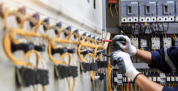 Professional Electrician technician working in Urbandale, IA
